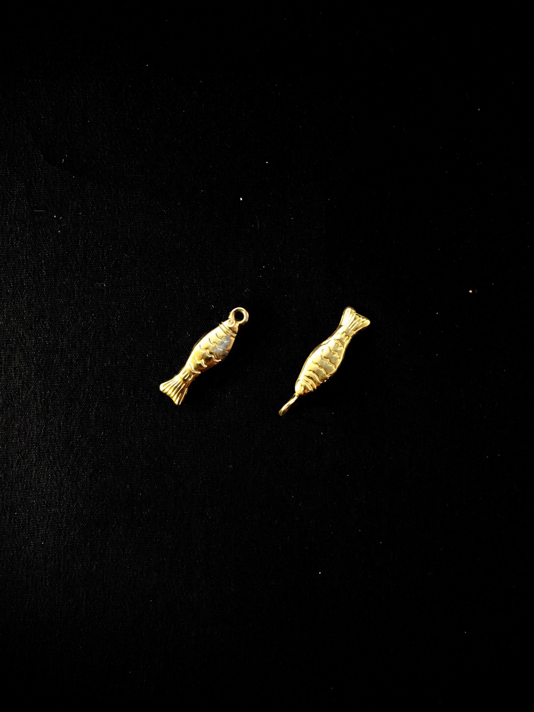 Gold Fish charm beside the original found fish
