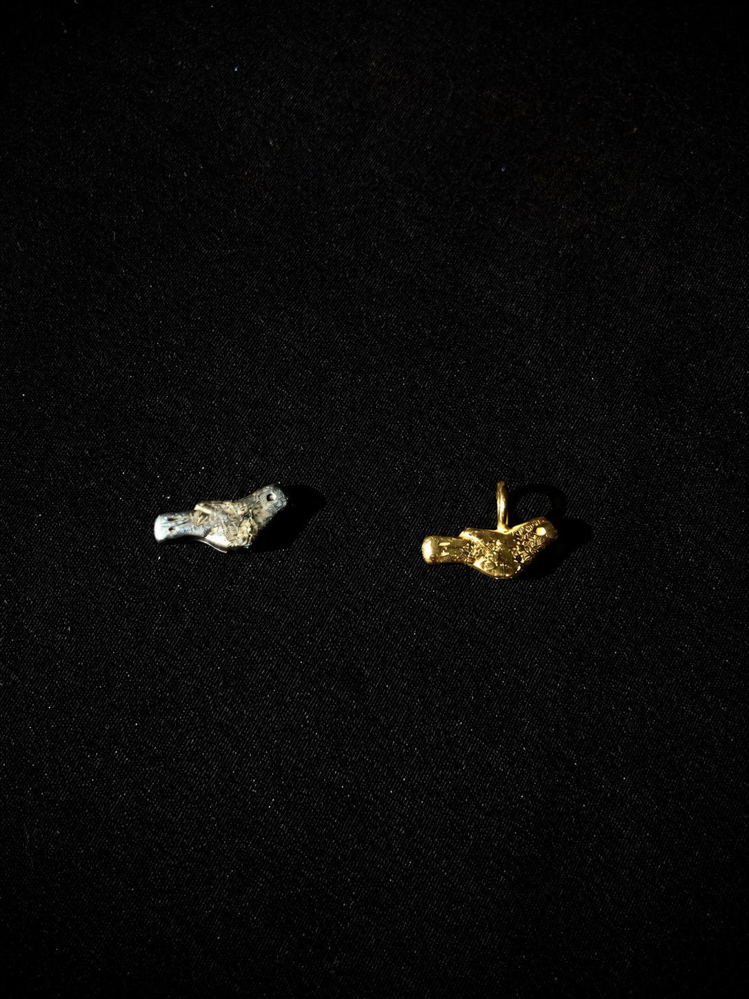 Gold Friend charm beside the original found bird